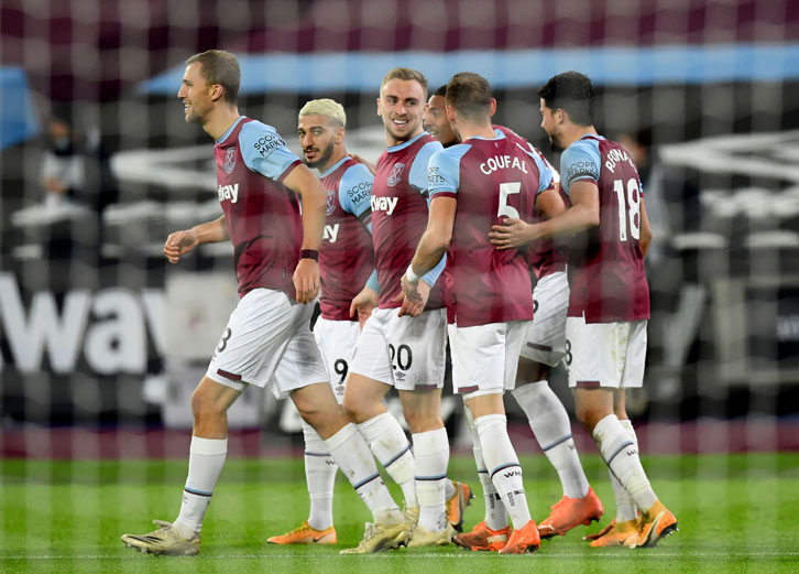 West Ham players celebrate scoring at London Stadium