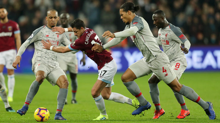 Chicharito takes on the Liverpool defence