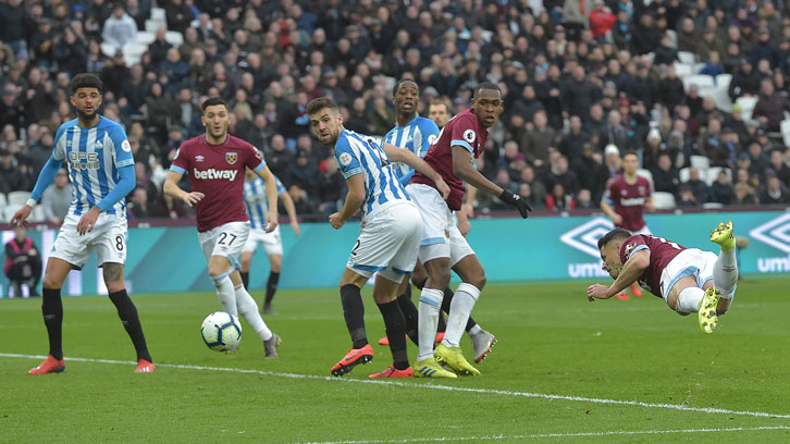 Chicharito scores the first of his two goals against Huddersfield