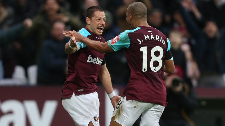 Chicharito celebrates scoring against Watford last time out with Joao Mario