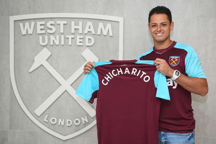 Javier Hernandez poses with the West Ham shirt