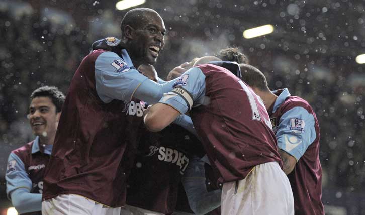 Carlton Cole celebrates the Hammers' 4-0 win over Man Utd in 2010