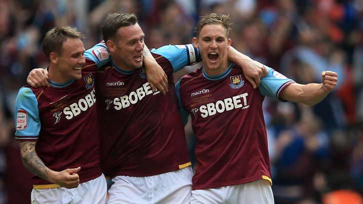 Jack Collison, Matty Taylor and Kevin Nolan celebrate winning promotion in 2012