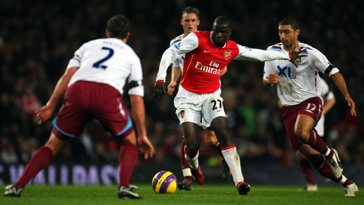 Jack Collison keeps an eye on Arsenal's Emmanuel Eboue during his West Ham United debut