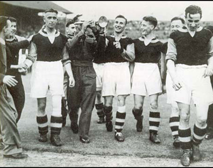 Norman Corbett (in uniform) celebrates West Ham United winning the Football League War Cup