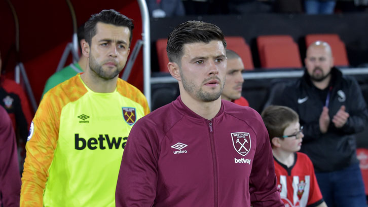 Aaron Cresswell leads West Ham United out to face Southampton