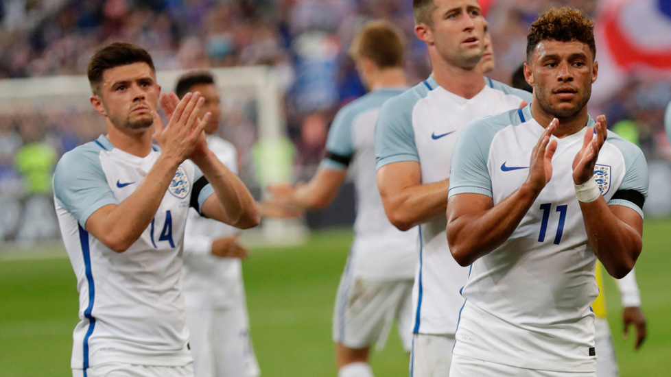 Aaron Cresswell applauds the fans at the end of England's game in France