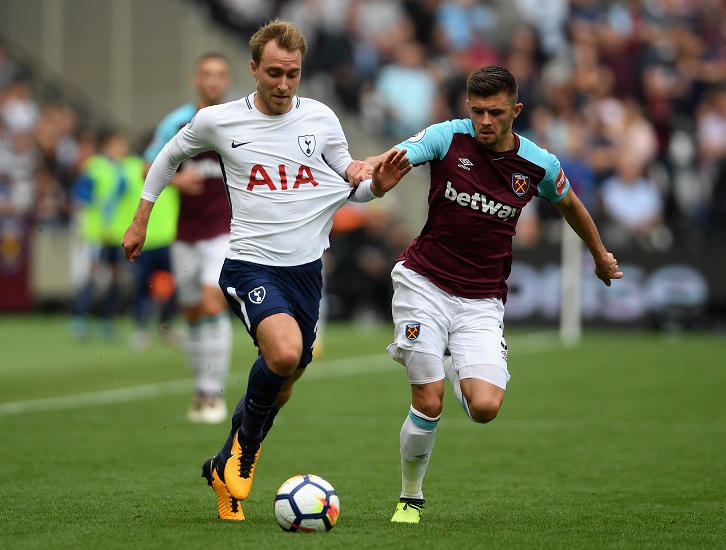 Aaron Cresswell challenges Tottenham Hotspur's Christian Eriksen