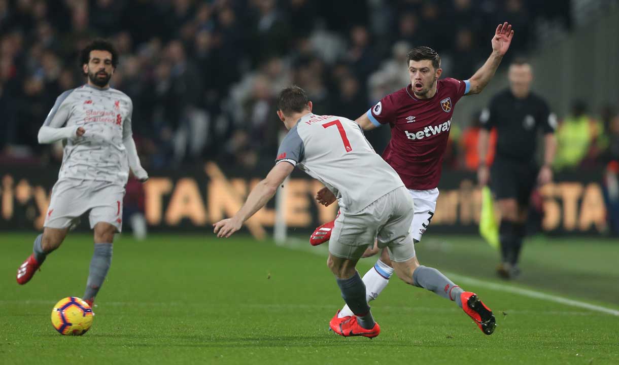 Aaron Cresswell takes on James Milner