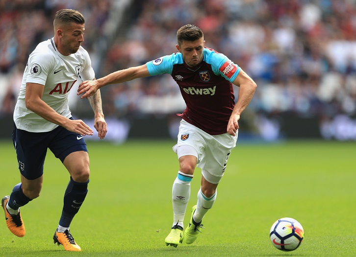Aaron Cresswell battles for possession with Tottenham's Toby Alderweireld