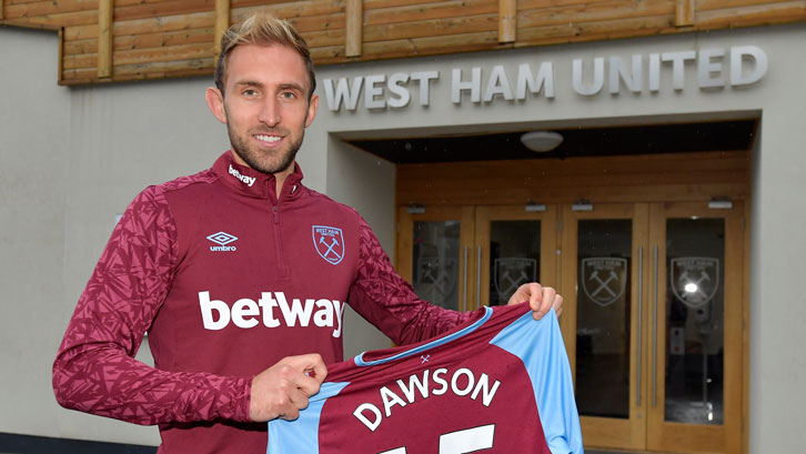 Craig Dawson signs