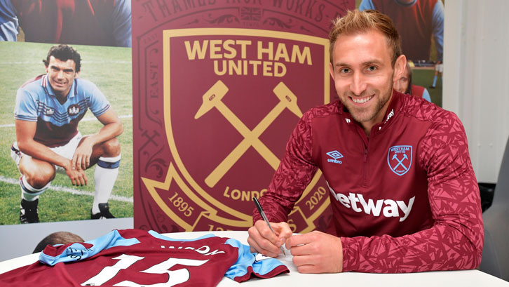 Craig Dawson signs