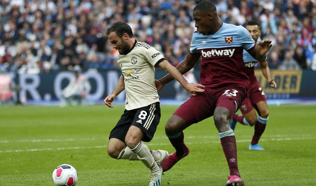 Issa Diop challenges Juan Mata