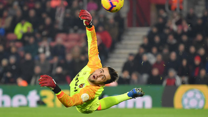 Lukasz Fabianski dives full-length to keep out Stuart Armstrong's curler