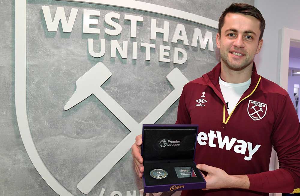 Lukasz Fabianski with his award for reaching 200 Premier League appearances