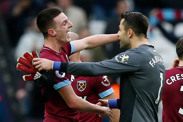 Lukasz Fabianski celebrates with Declan Rice