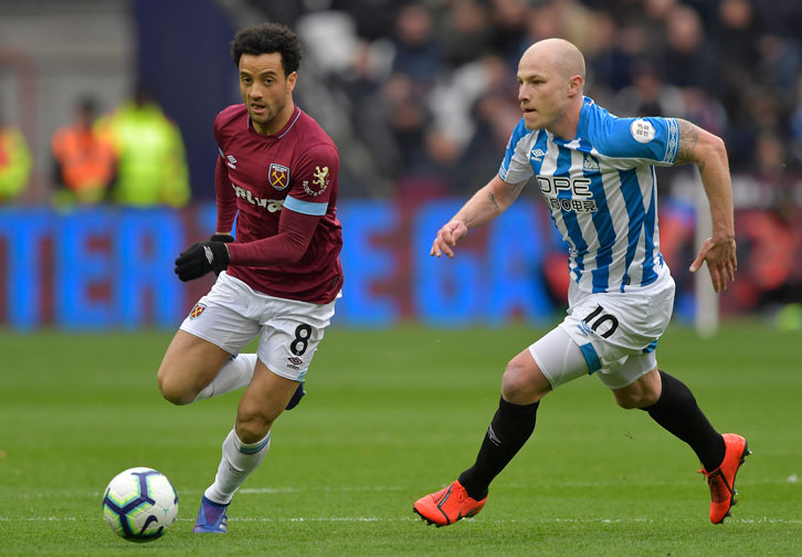 Felipe Anderson gets away from Aaron Mooy