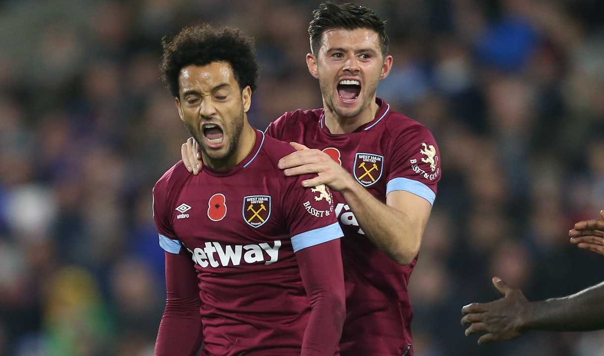 Felipe Anderson and Aaron Cresswell celebrate at Huddersfield