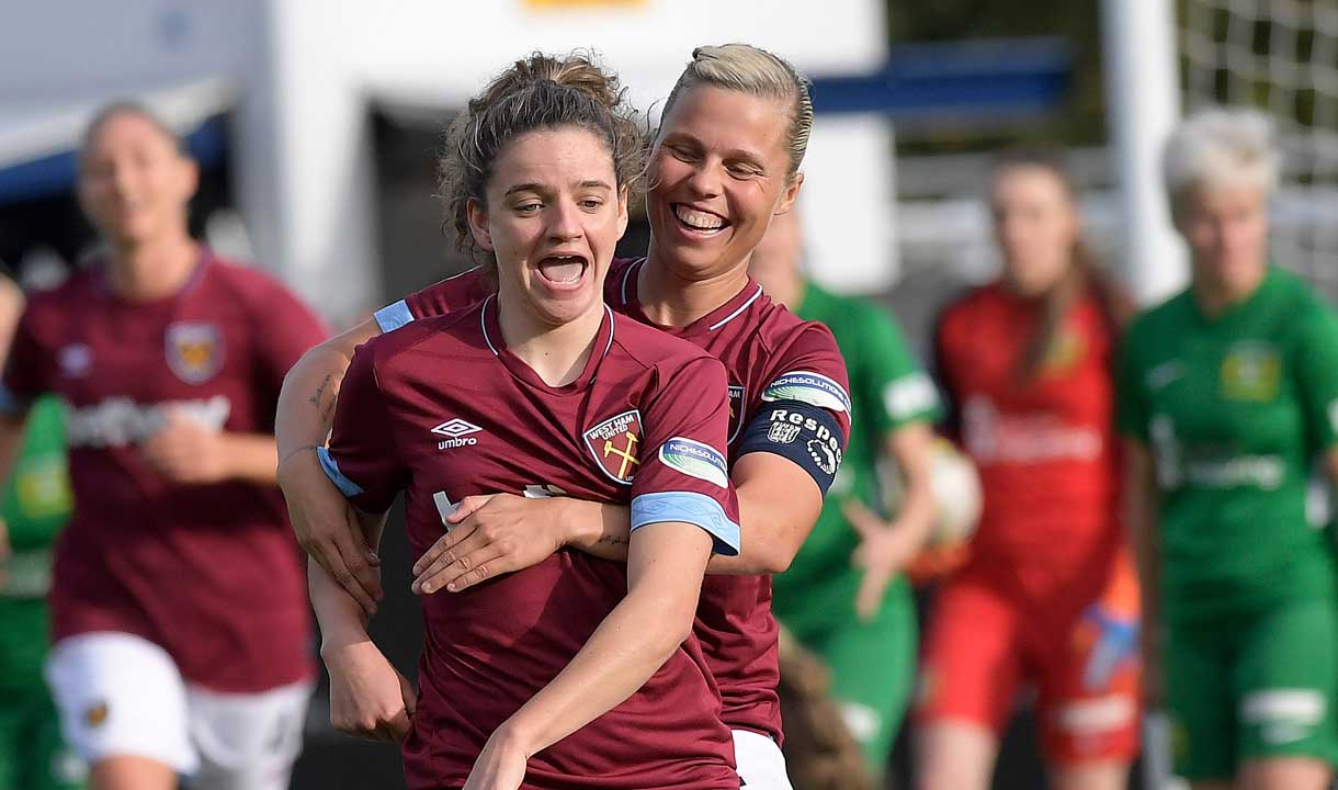 Gilly Flaherty celebrates a goal with Leanne Kiernan