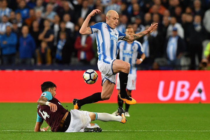 Jose Fonte challenges Huddersfield Town's Aaron Mooy