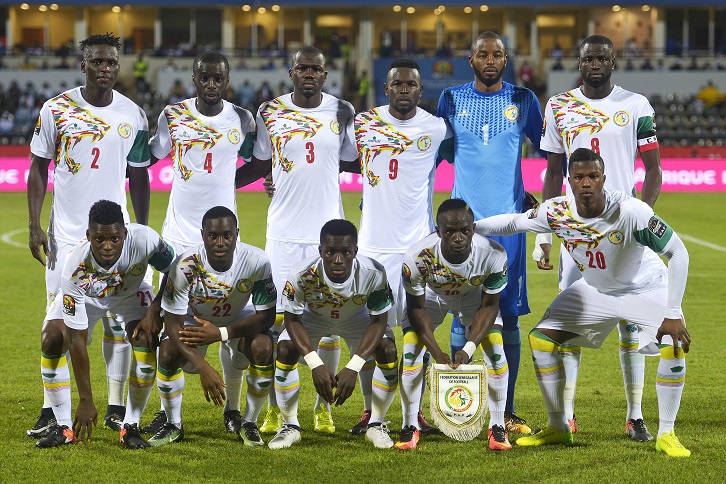 Cheikhou Kouyate (back row, far left) and Sadio Mane (holding pennant) will represent Senegal at Russia 2018