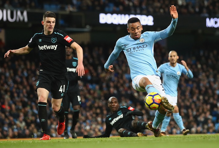 Declan Rice keeps an eye on Manchester City's Gabriel Jesus