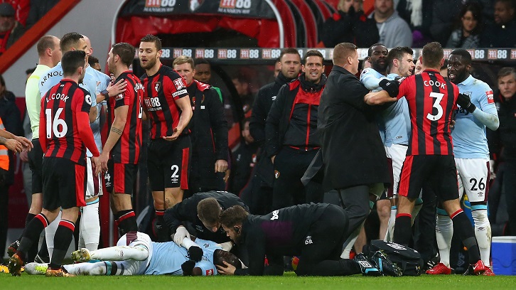 Cheikhou Kouyate receives treatment after being caught in the face by Simon Francis' boot