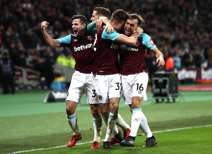 Reece Burke celebrates his winning goal with Mark Noble