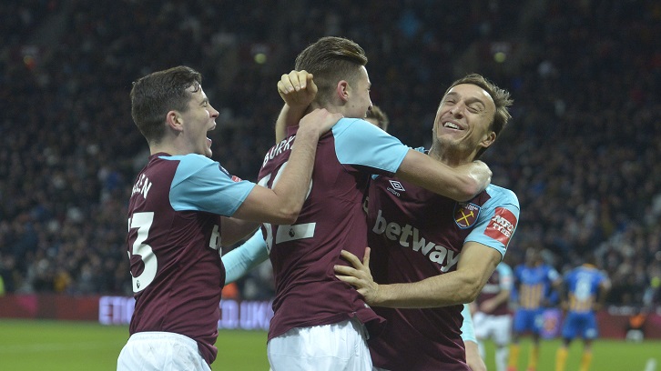 Josh Cullen and Reece Burke celebrate with Mark Noble
