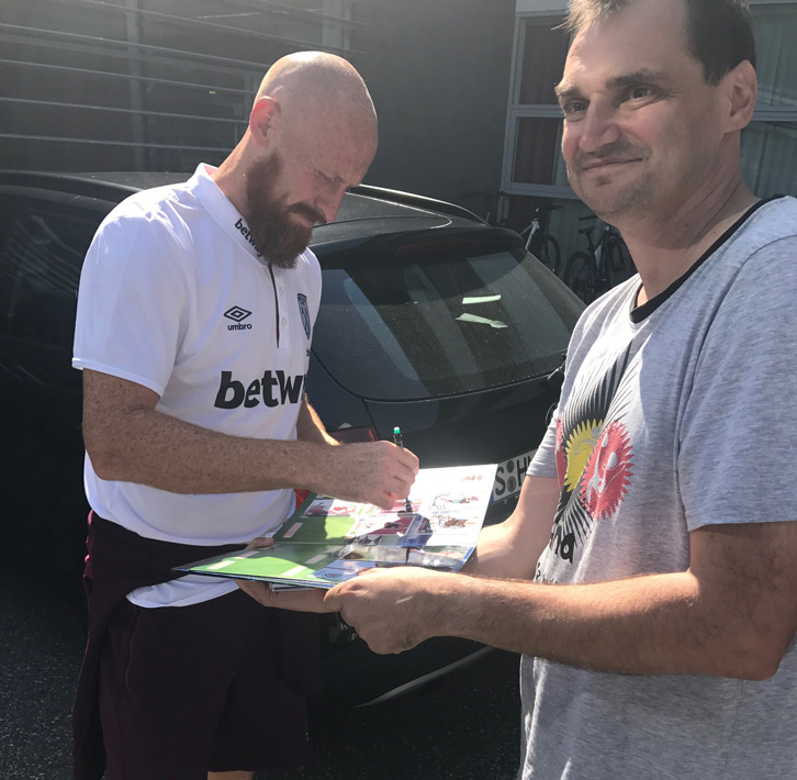 James Collins signs an autograph
