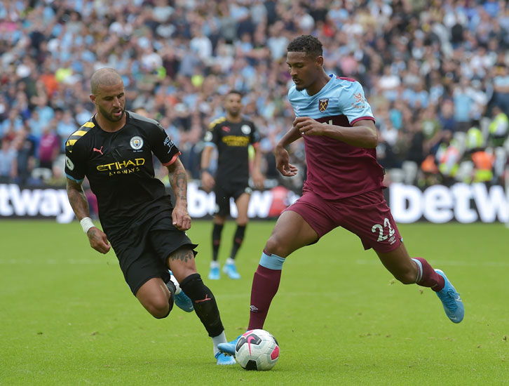 Sebastien Haller takes on Manchester City full-back Kyle Walker