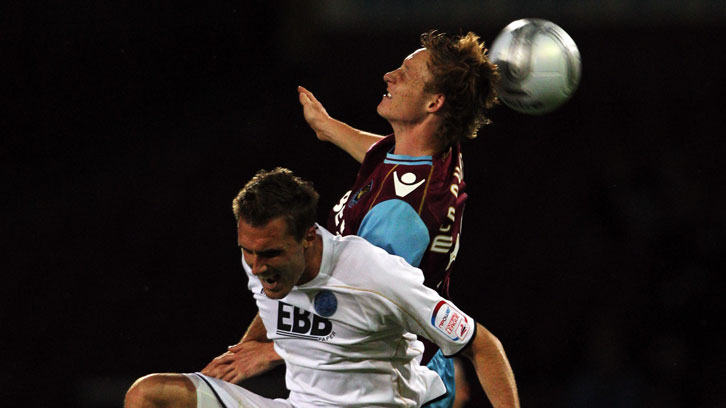 Callum McNaughton wins a header on his debut