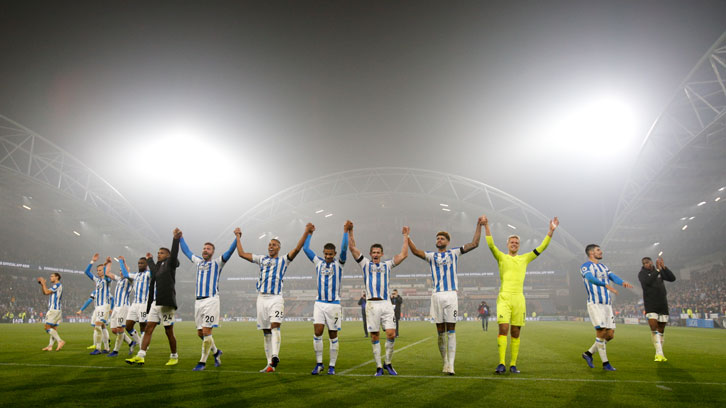 Huddersfield Town's players celebrate beating Fulham on Monday