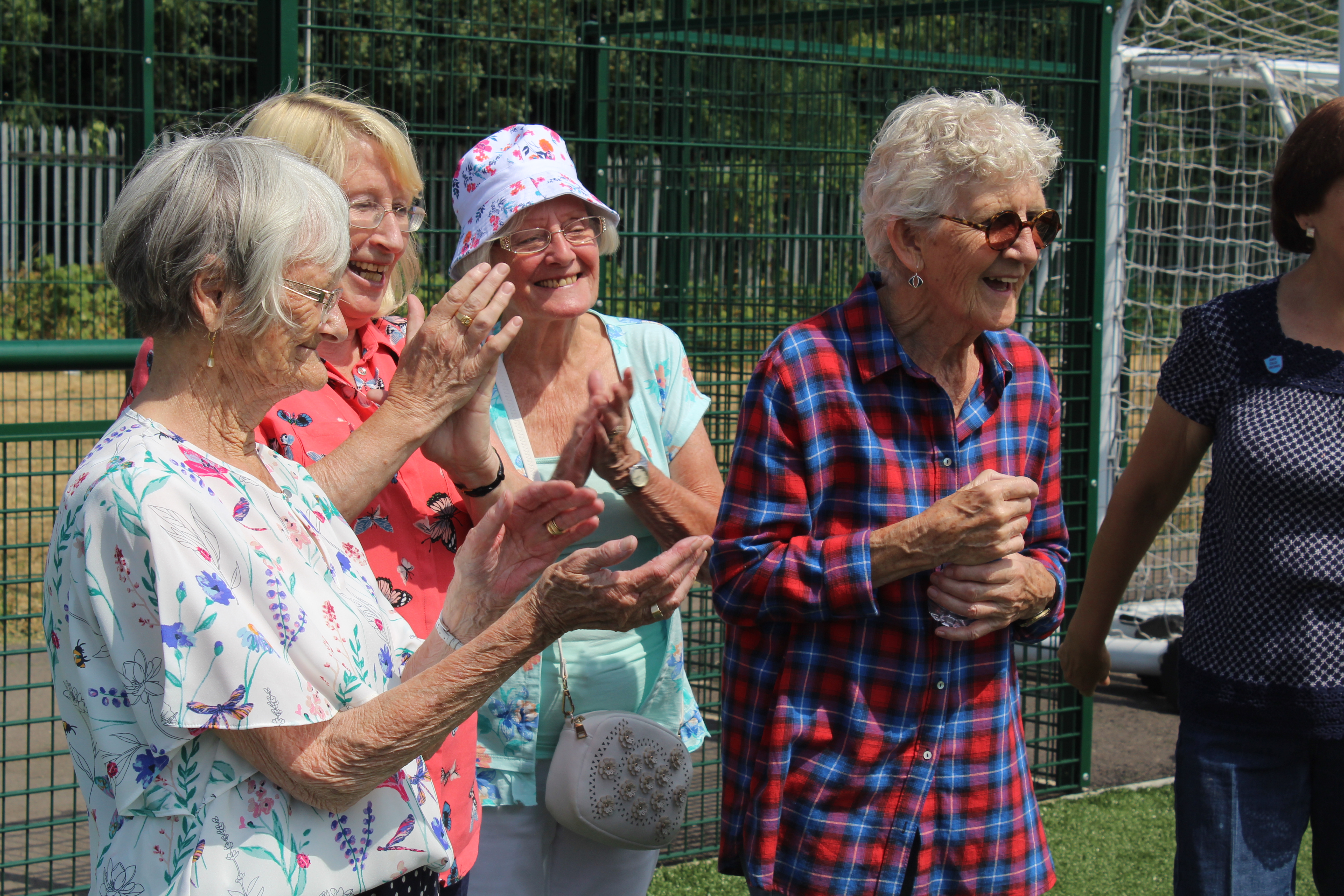 Any Old Irons cheer on each other at community golf