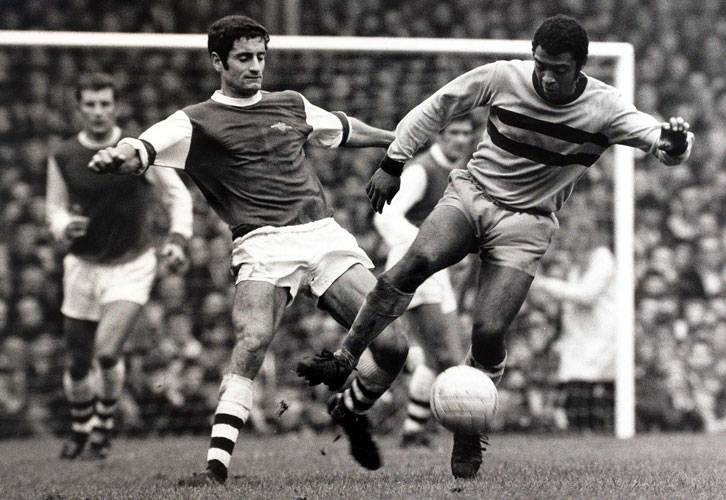 John Charles challenges Arsenal's Frank McLintock for the ball in October 1968
