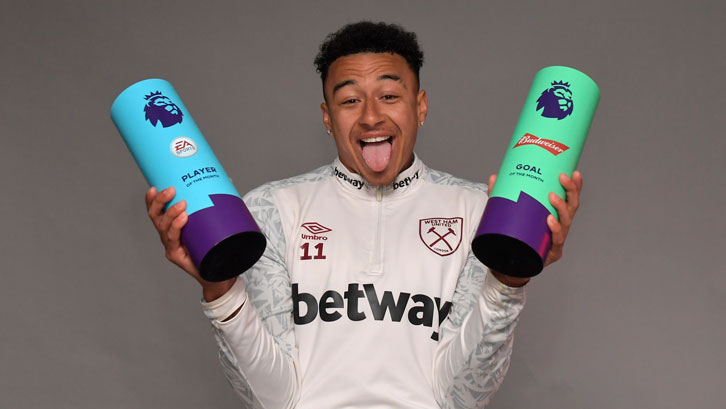 Jesse Lingard holds his two awards