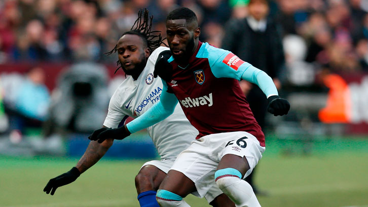 Arthur Masuaku challenges Chelsea's Victor Moses