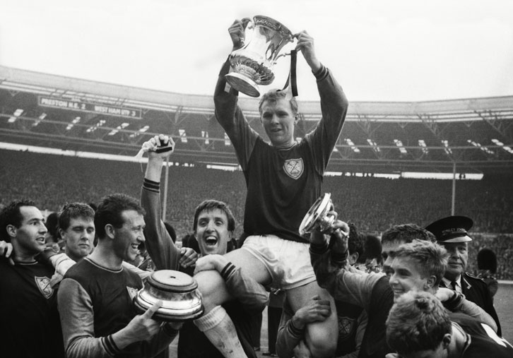 Bobby Moore lifts the FA Cup in 1964