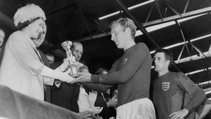 Bobby Moore is presented with the Jules Rimet Trophy