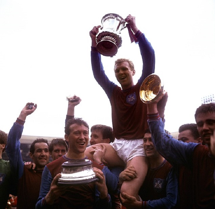 Ken Brown and Bobby Moore celebrate FA Cup glory in 1964