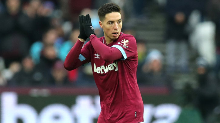 Samir Nasri applauds the Claret and Blue Army on his way off the pitch