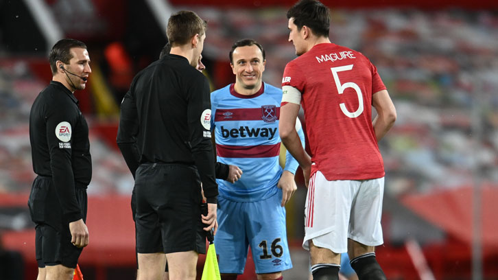 Mark Noble with Harry Maguire