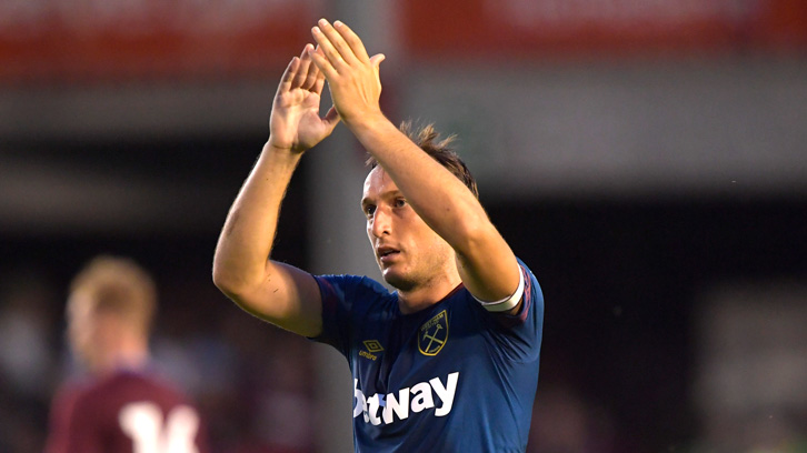 Mark Noble acknowledges the West Ham supporters at Aston Villa