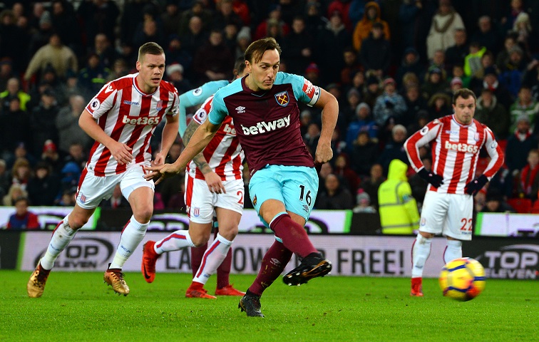 Mark Noble scores from the penalty spot at Stoke City