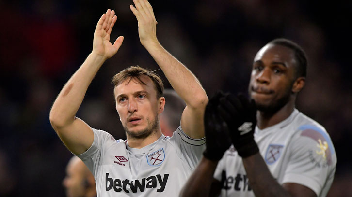 Mark Noble acknowledges the West Ham supporters at Burnley