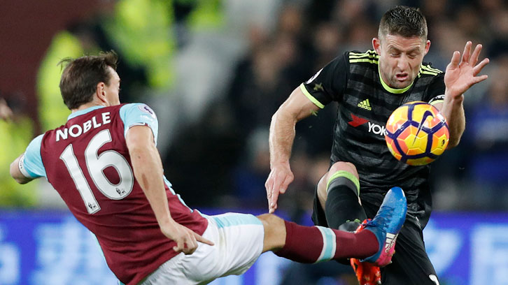 Mark Noble battles Gary Cahill for possession