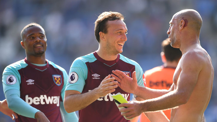 Mark Noble celebrates victory with Pablo Zabaleta