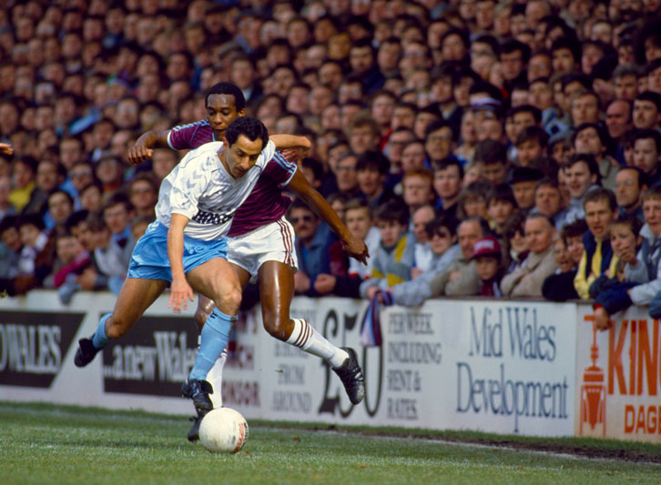 George Parris challenges Tottenham's Ossie Ardiles