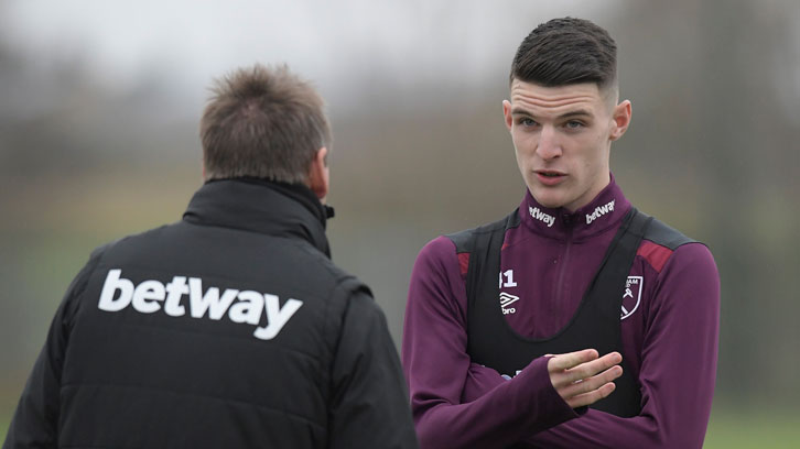 Stuart Pearce talks to Declan Rice during a training session at Rush Green