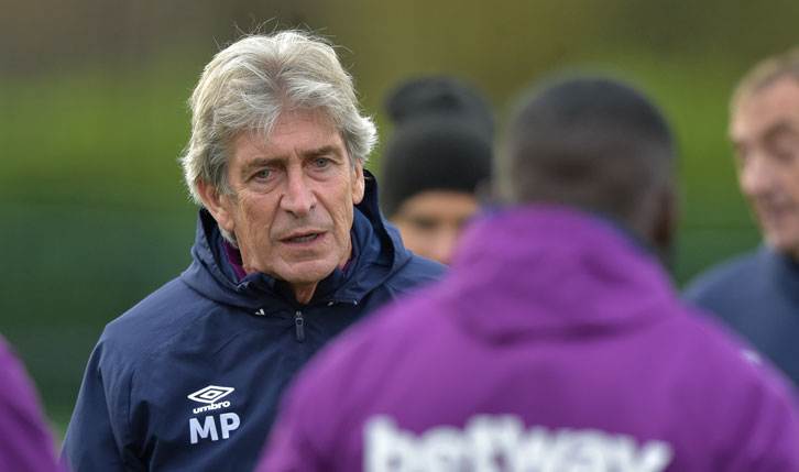 Manuel Pellegrini takes his squad in training at Rush Green